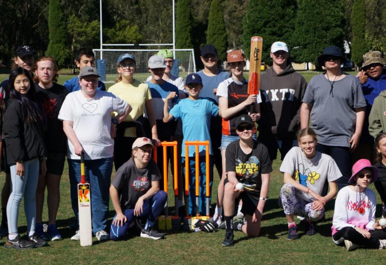 Group of blind children playing cricket