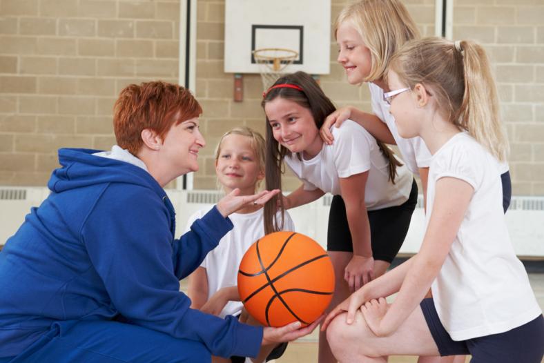 Coach and kids at basketball